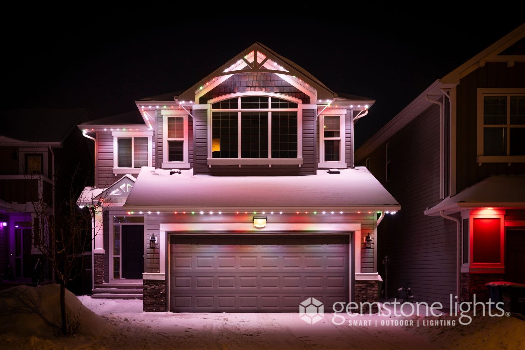 Holiday Gemstone lights on a two-story house