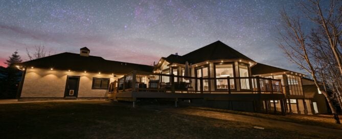 Local LightXP crew installing permanent Gemstone outdoor lighting — what’s included beyond the lights.