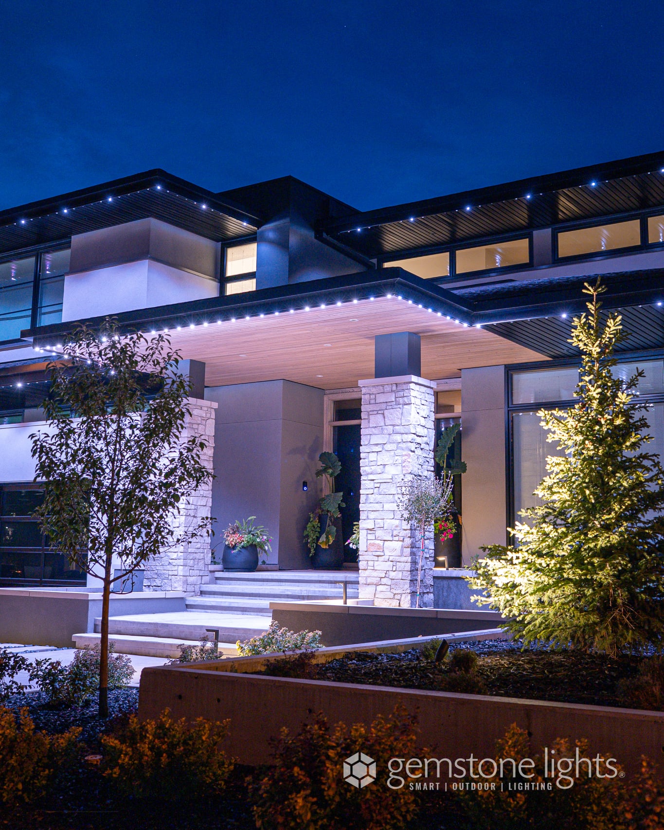 Contemporary home with warm-white Gemstone architectural lighting on the roofline