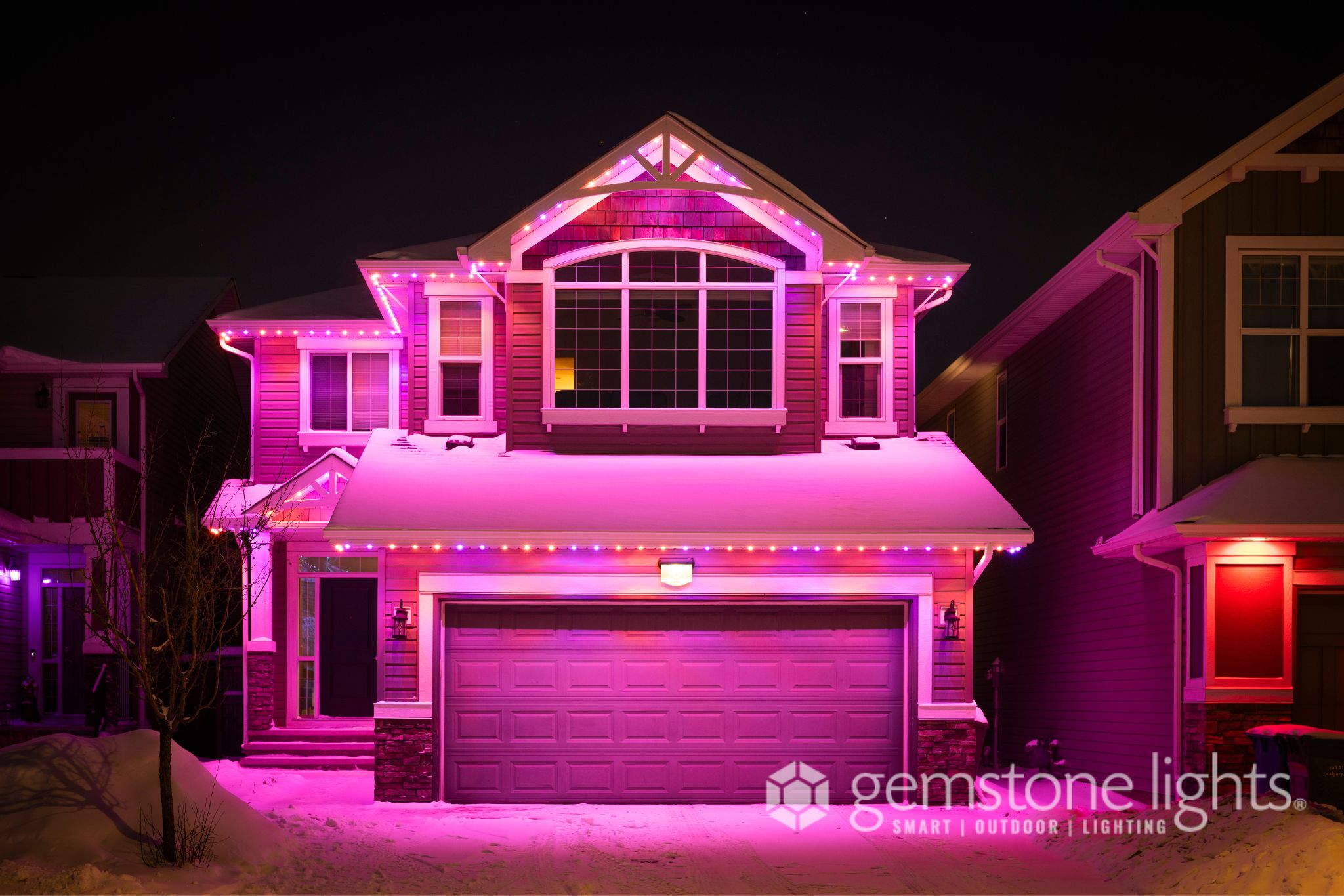 Color-matched permanent light track along soffit and fascia.